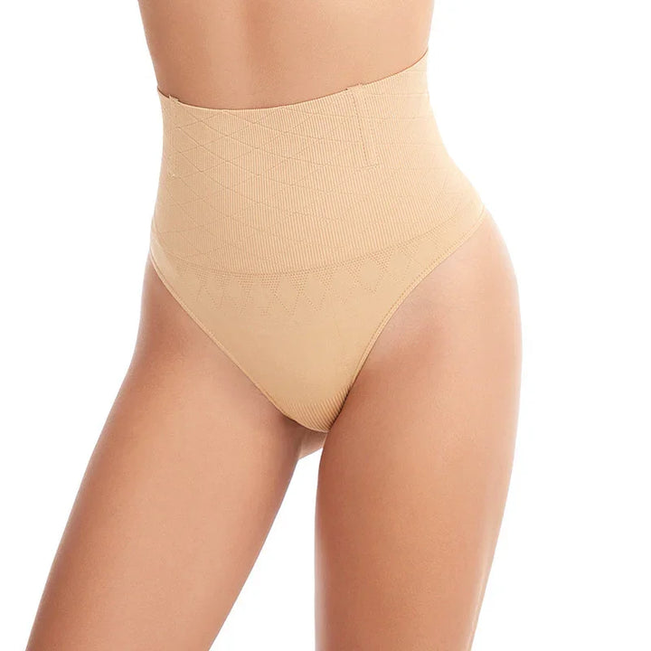 Woman wearing nude high-waisted seamless shapewear thong on white background