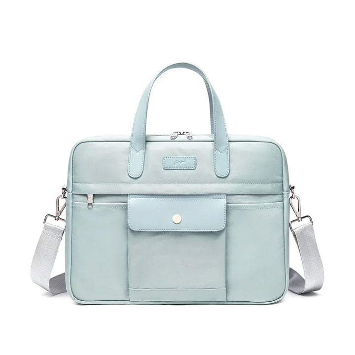 Light blue laptop bag with double handles, front pocket, and detachable shoulder strap