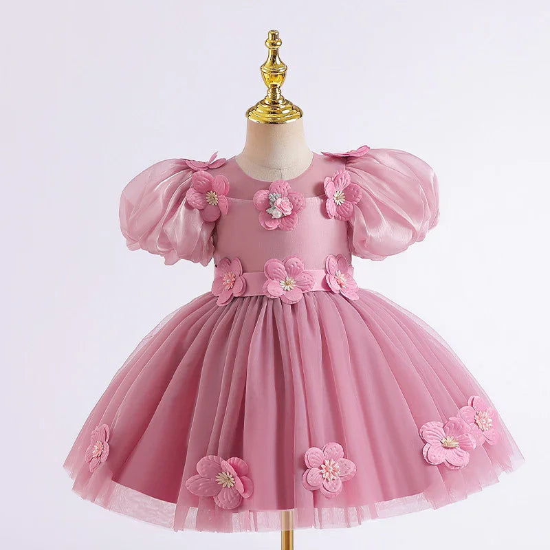 Pink toddler dress with puff sleeves and 3D floral appliques on bodice and tulle skirt