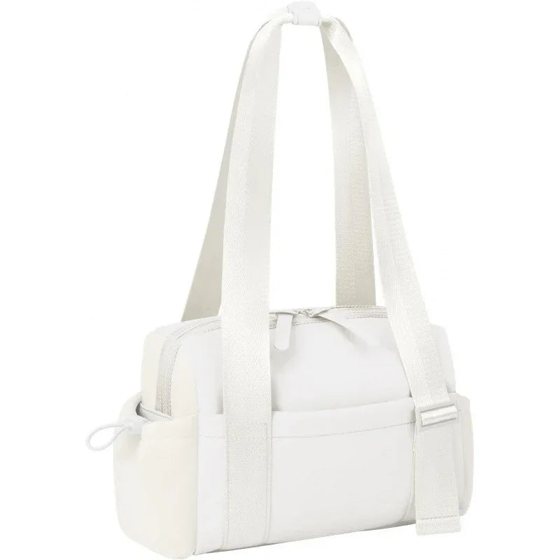 White small shoulder bag with adjustable straps, zipper closure, and side pockets