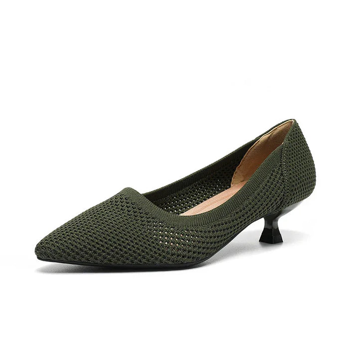 Green knit pointed toe women’s kitten heel shoe with low black heel on white background