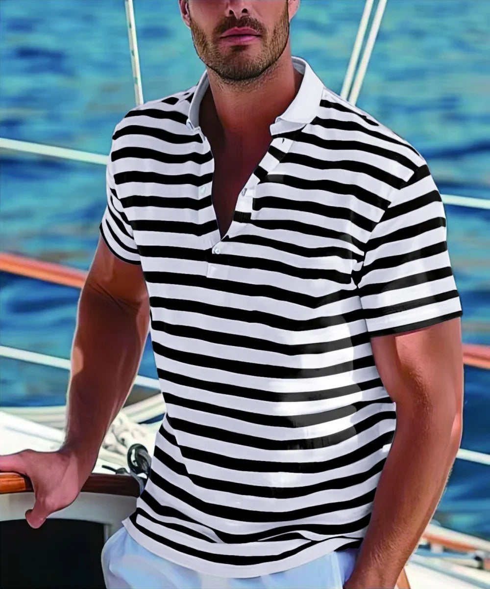 Man wearing black and white striped polo shirt on a boat with sea background
