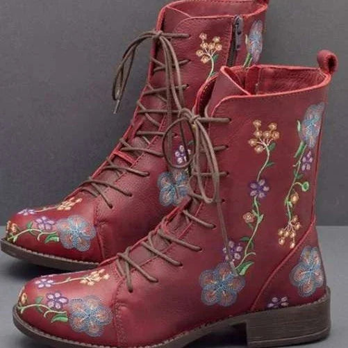 Red leather lace-up boots with embroidered colorful floral patterns and side zipper