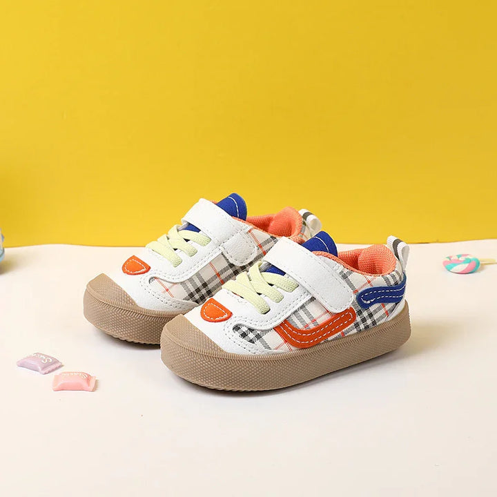 Children's casual sneakers with beige rubber soles, plaid pattern, and colorful orange and blue accents