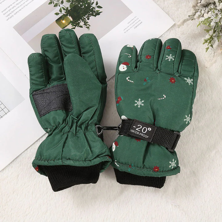 Pair of green waterproof winter gloves with festive snowflake and Santa patterns, temperature rating -20°
