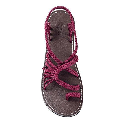 brown sandal with burgundy braided straps and toe loop on white background