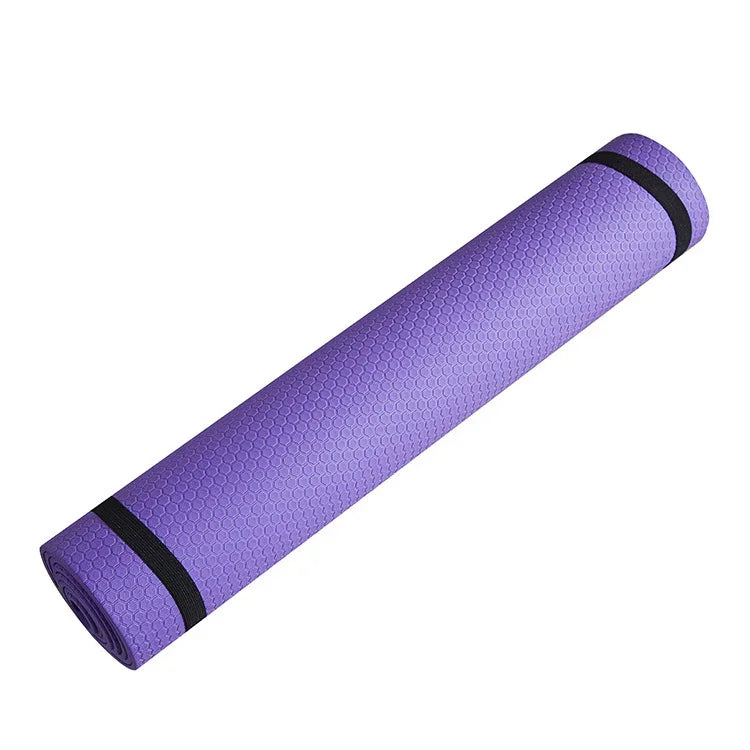 Purple textured yoga mat rolled up with black straps, fitness and exercise accessory