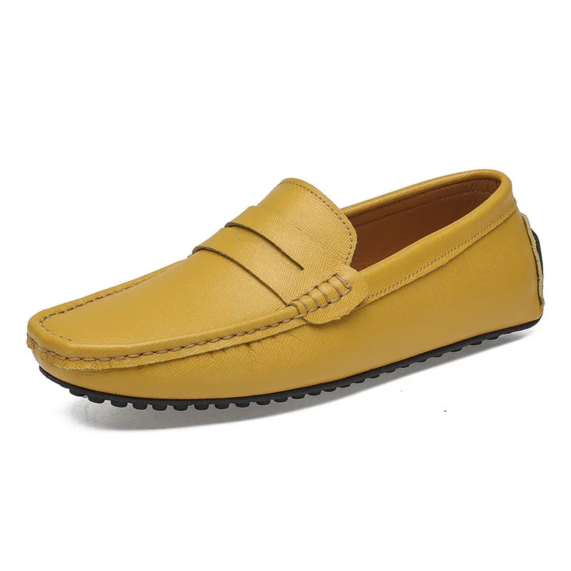 Yellow leather men's driving loafer with black rubber sole and stitched detailing