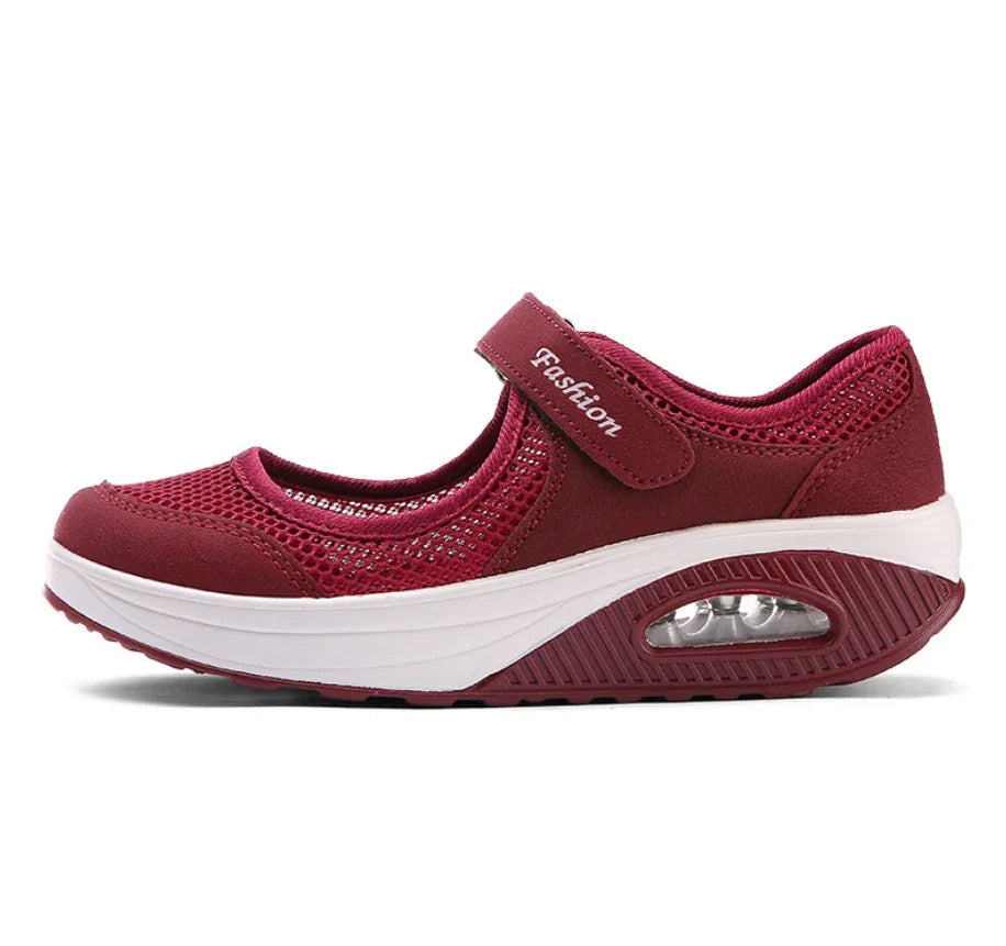 Red mesh breathable Mary Jane sneaker with white platform sole and air cushion heel