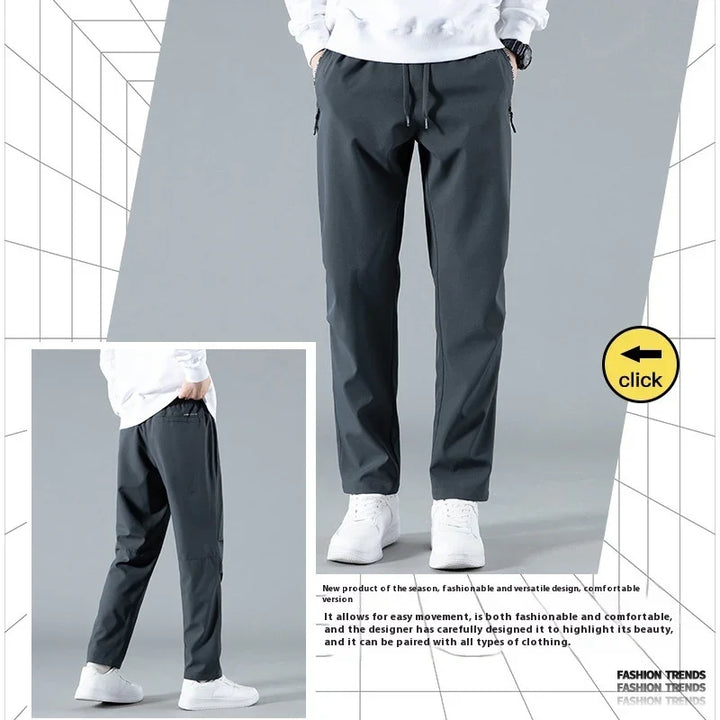 Men's black casual trousers with drawstring paired with white sneakers and white sweatshirt
