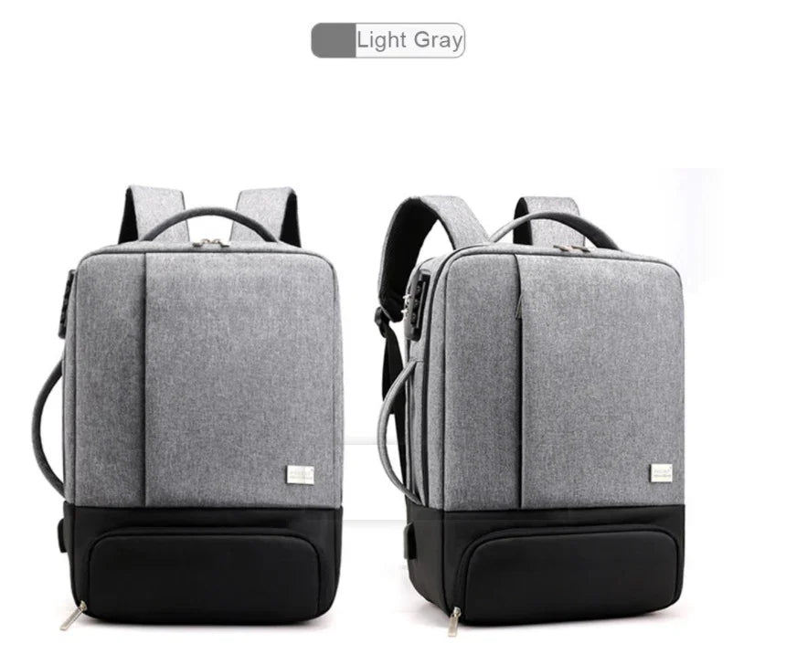 Light gray modern backpack with black base, front and side straps, multiple compartments, and padded shoulder straps
