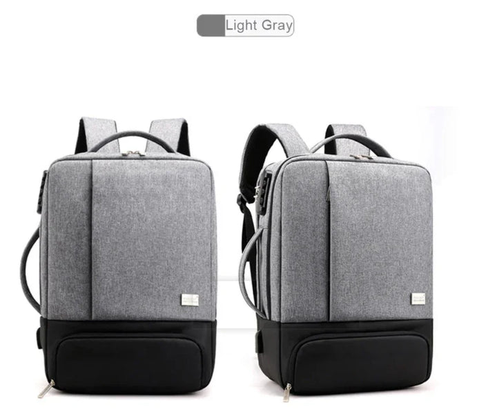 Light gray modern backpack with black base, front and side straps, multiple compartments, and padded shoulder straps