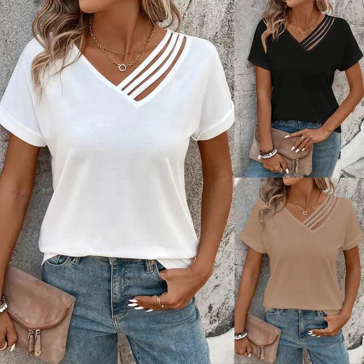 Women wearing casual v-neck tops with strap detail in white, black, and beige paired with blue jeans and accessories