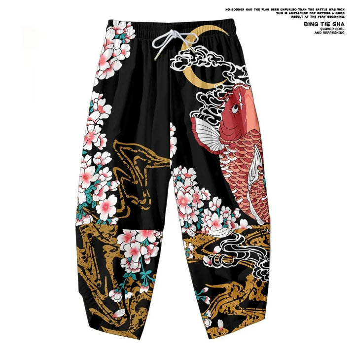 Black pants with colorful koi fish, cherry blossoms, gold and white cloud designs, and white drawstring