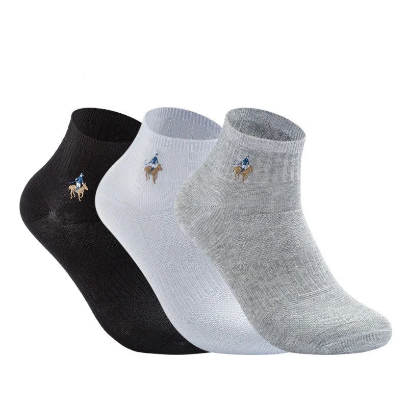 Set of three ankle socks in black, white, and gray with small embroidered polo player logo