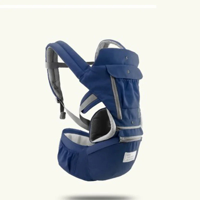 Navy blue ergonomic baby carrier with padded straps and storage pockets against white background