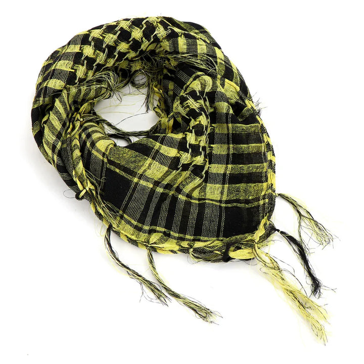 Yellow and black checkered woven scarf with fringed edges on white background