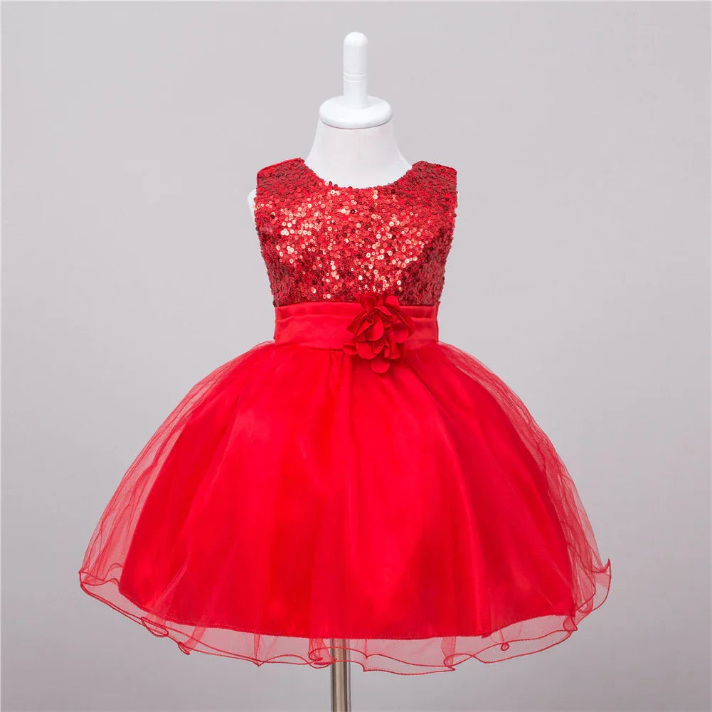 Red sequined sleeveless toddler dress with tulle skirt and floral waistband on mannequin