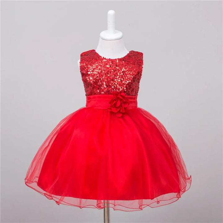 Red sequined sleeveless toddler dress with tulle skirt and floral waistband on mannequin