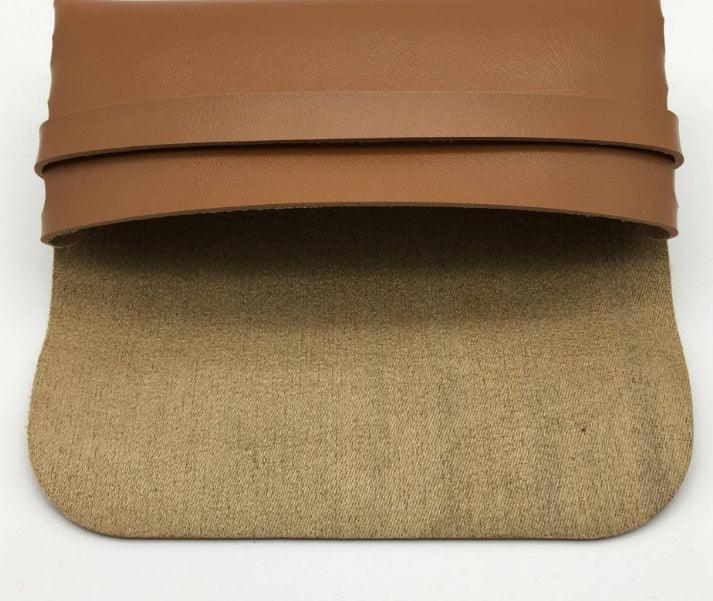 Brown leather and beige fabric open pouch bag on white background