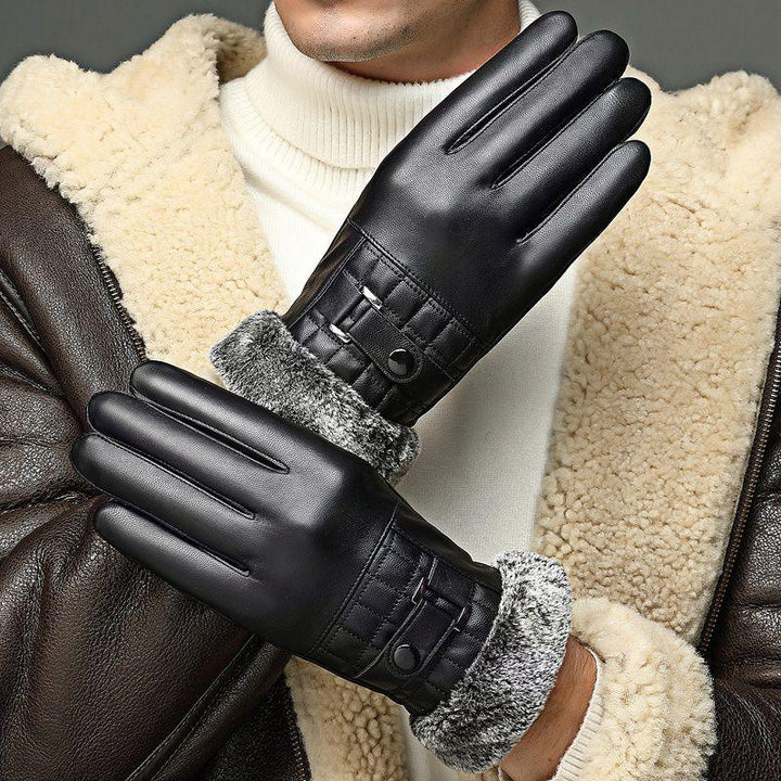 Man wearing black leather winter gloves with faux fur lining and a shearling jacket