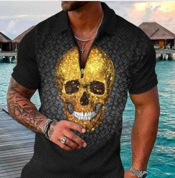 Man wearing black short-sleeve shirt with large gold skull design, standing by water and wooden huts