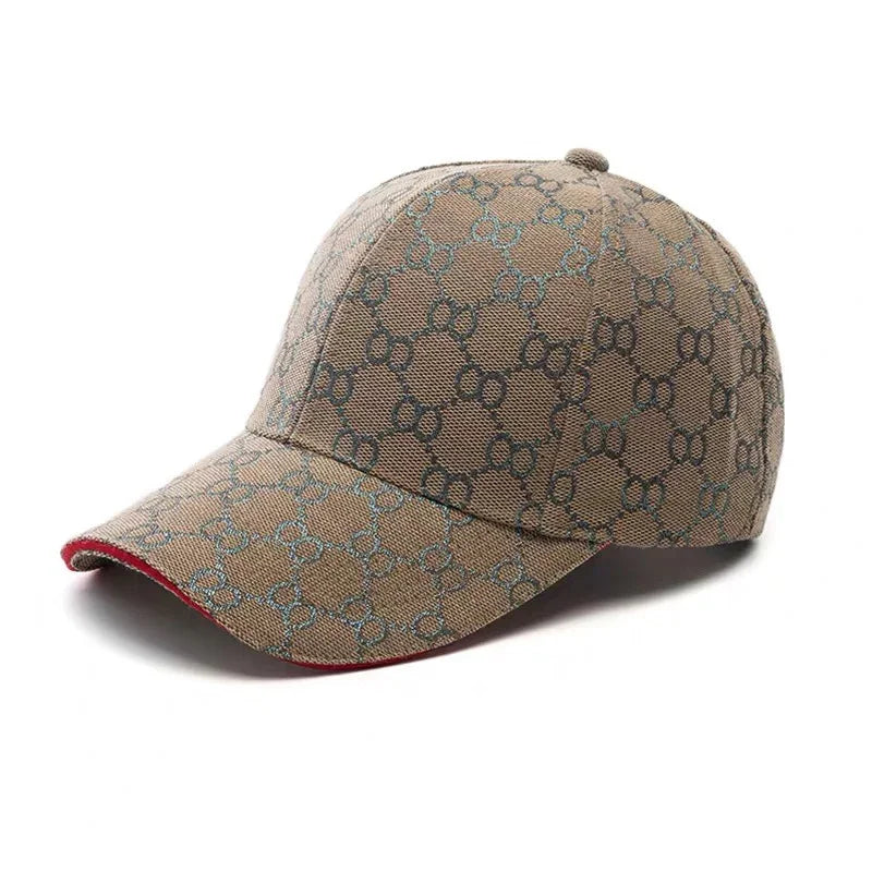 Beige designer baseball cap with all-over interlocking GG monogram pattern and red trim on the brim