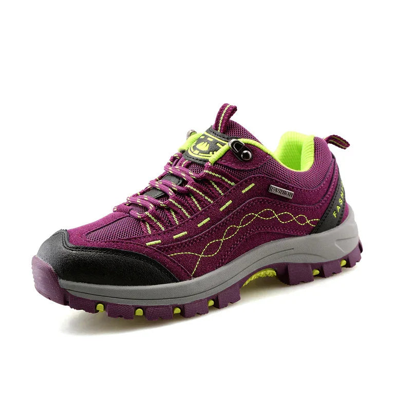 Purple and neon green hiking shoe with rugged sole and mesh fabric upper