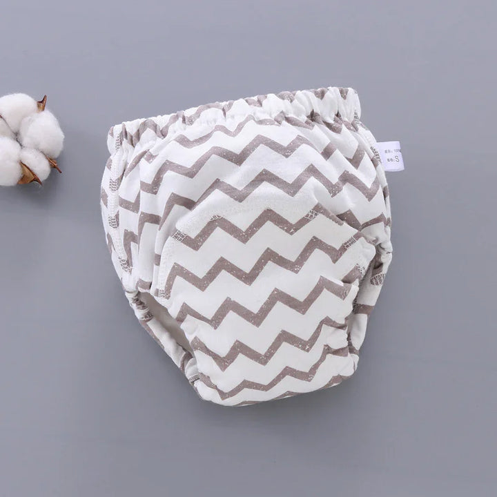Reusable cloth diaper with brown zigzag pattern on gray background, eco-friendly baby diaper