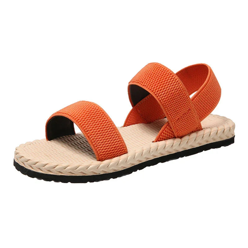 Orange strap summer sandal with beige woven sole and black outsole