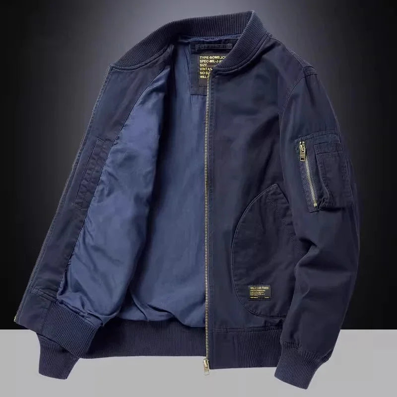 Navy blue bomber jacket with zippered front, ribbed cuffs and collar, inner lining, and zippered sleeve pocket