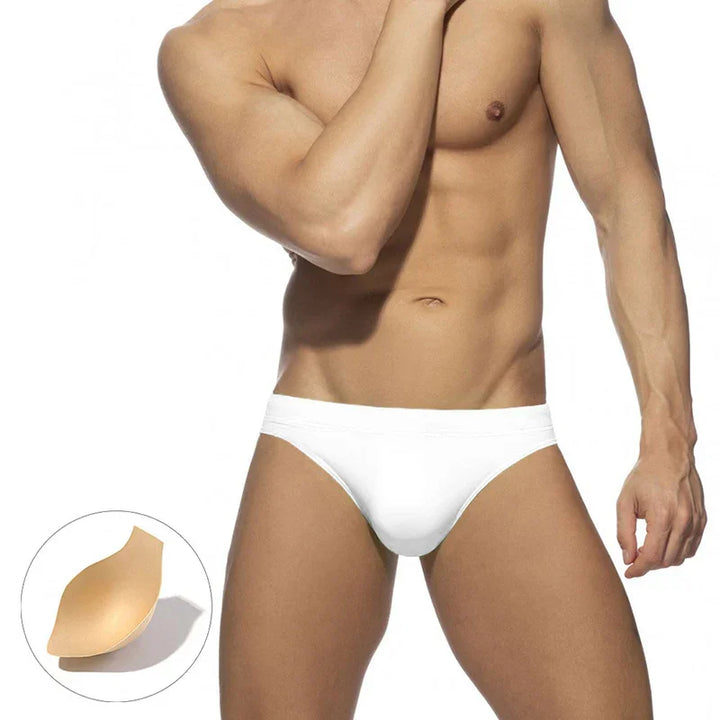 muscular man wearing white bikini-style underwear with removable padded cup shown