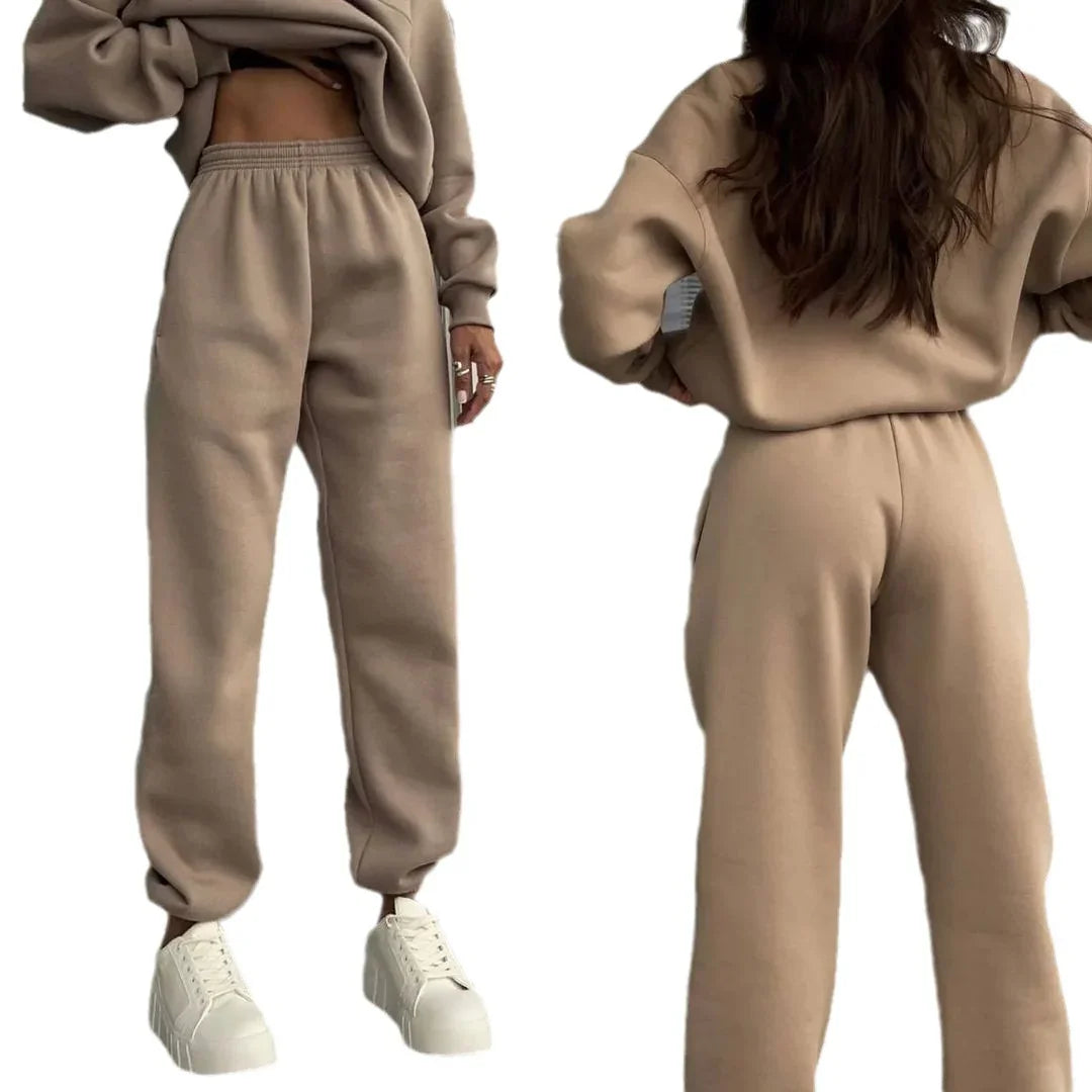 Front and back views of beige fleece jogger sweatpants worn with matching sweatshirt and white sneakers