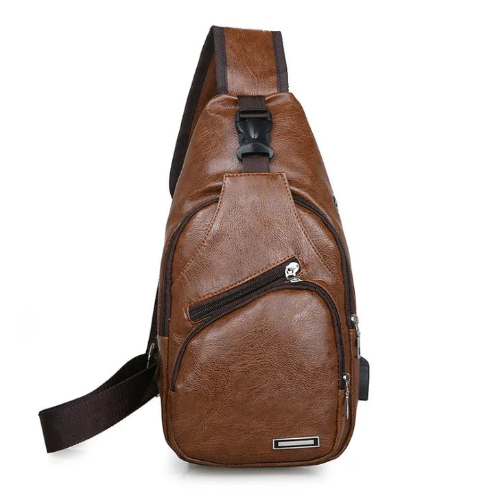 Brown leather sling backpack with multiple zippered pockets and adjustable strap