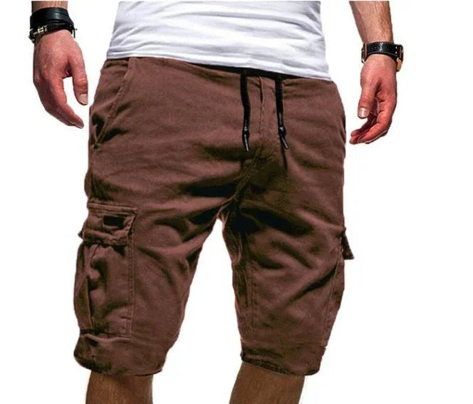 Men's brown cargo shorts with side pockets and drawstring waist, paired with a white t-shirt