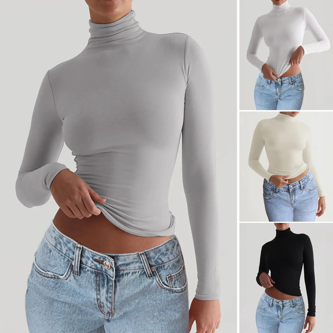 Woman wearing slim-fit turtleneck long sleeve tops in gray, white, cream, and black paired with blue jeans