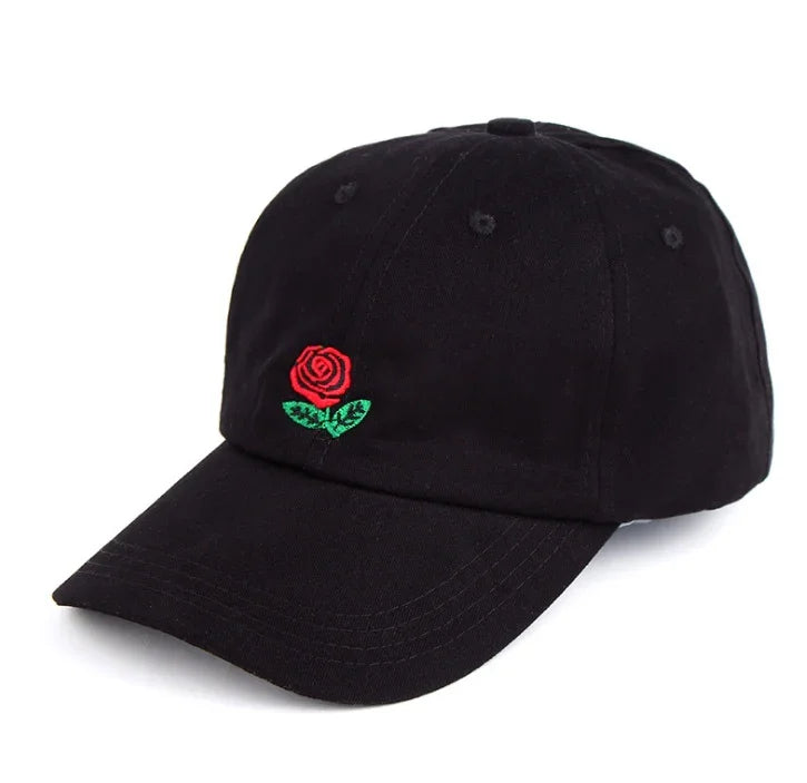 Black baseball cap with a small embroidered red rose and green leaves on the front