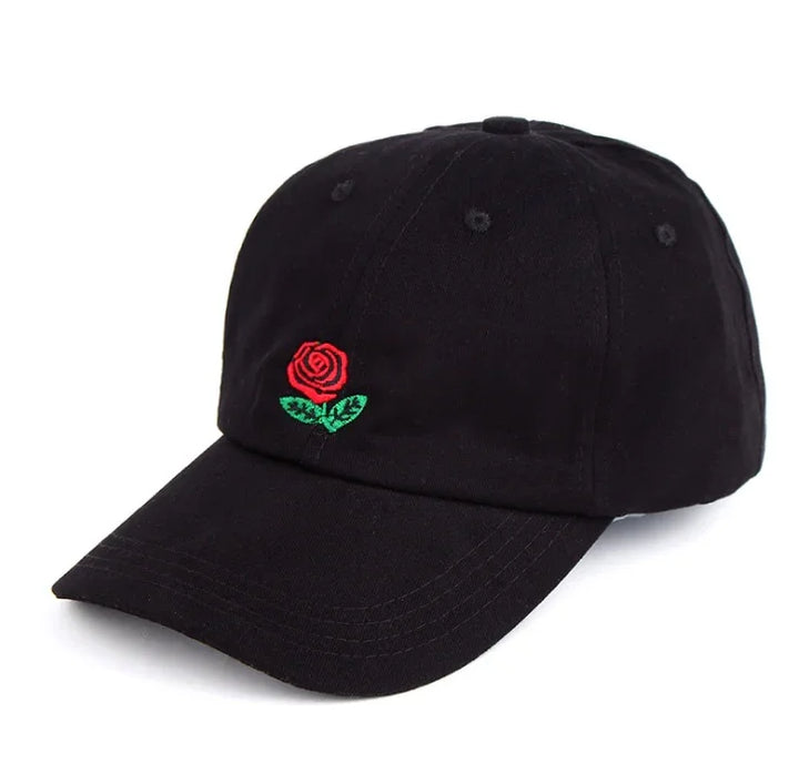 Black baseball cap with a small embroidered red rose and green leaves on the front