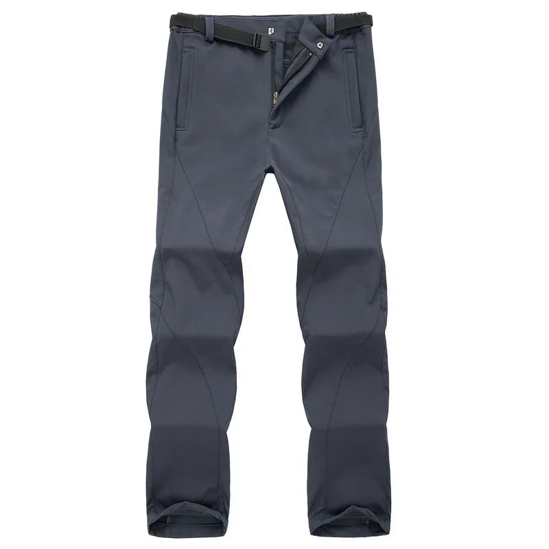 Dark gray outdoor hiking pants with belt and zippered fly against white background
