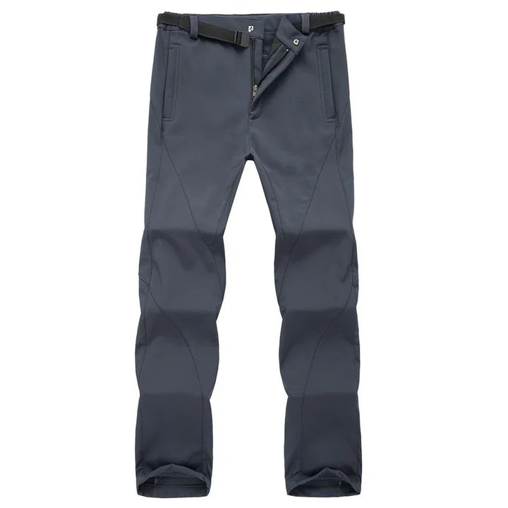 Dark gray outdoor hiking pants with belt and zippered fly against white background