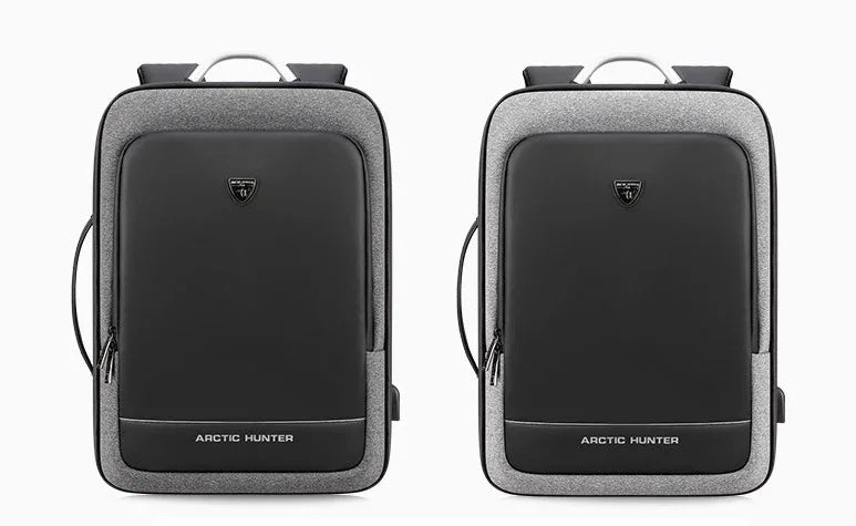 Two sleek Arctic Hunter black and grey expandable backpacks with front logo and side USB port