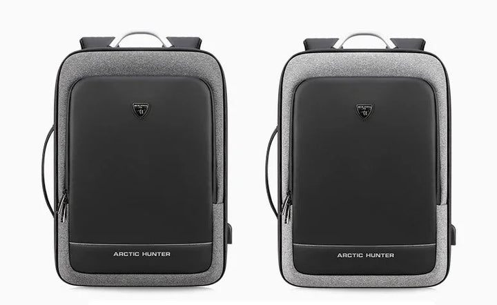 Two sleek Arctic Hunter black and grey expandable backpacks with front logo and side USB port