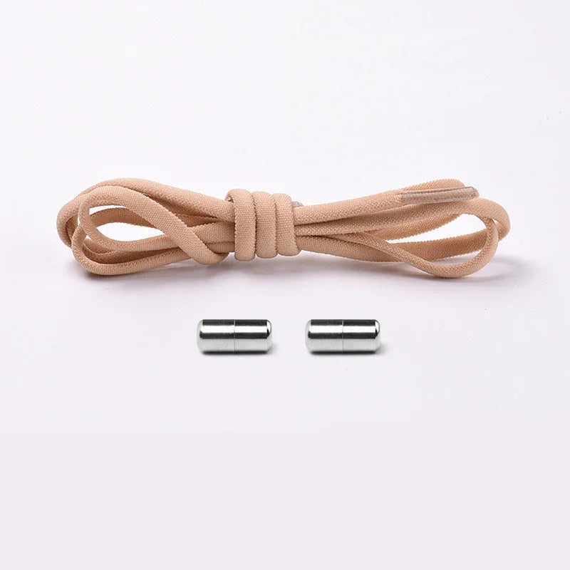 Beige elastic shoelace with metal no tie lock system on white background
