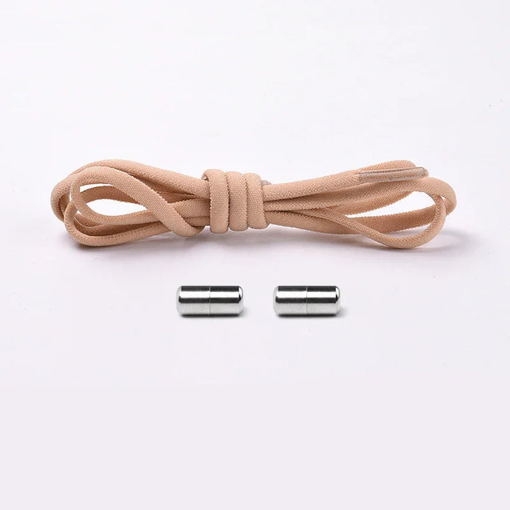 Beige elastic shoelace with metal no tie lock system on white background
