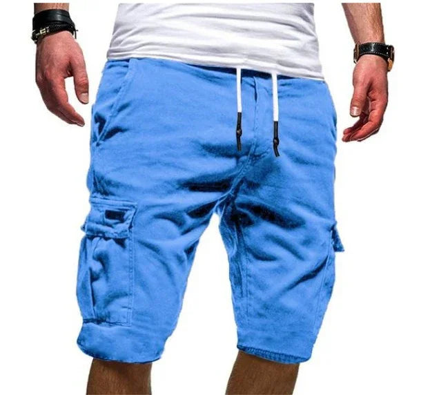 Man wearing bright blue cargo shorts with front pockets and white drawstring, paired with white shirt