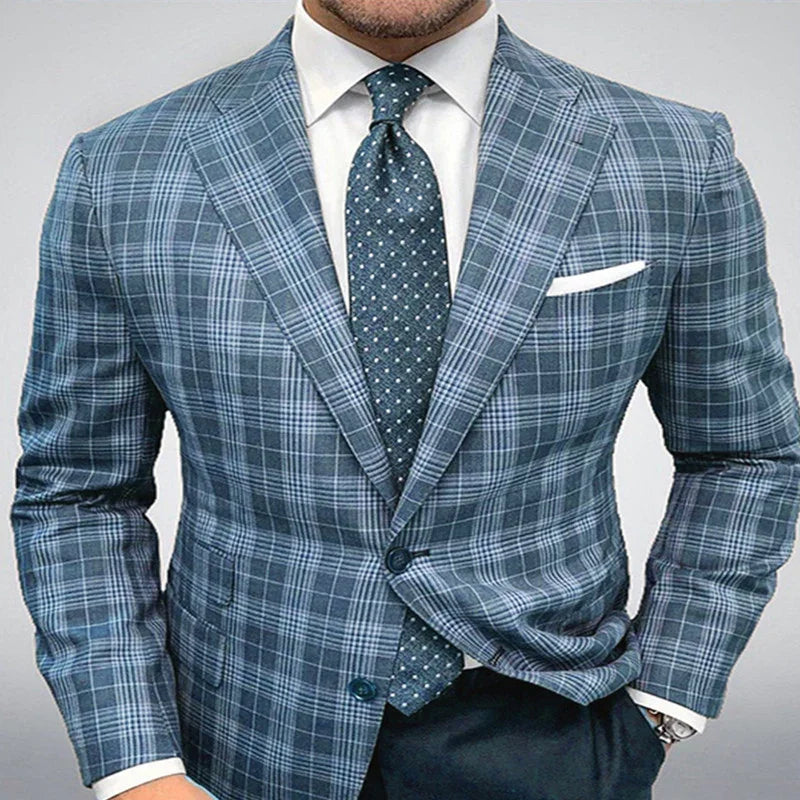 Man wearing a blue plaid suit jacket with a white shirt and blue polka dot tie