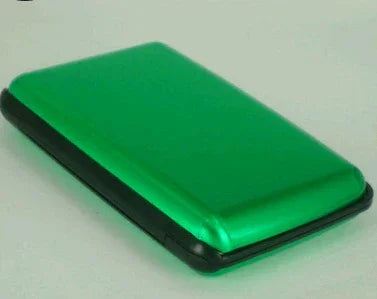 Compact green and black portable external hard drive on a white surface