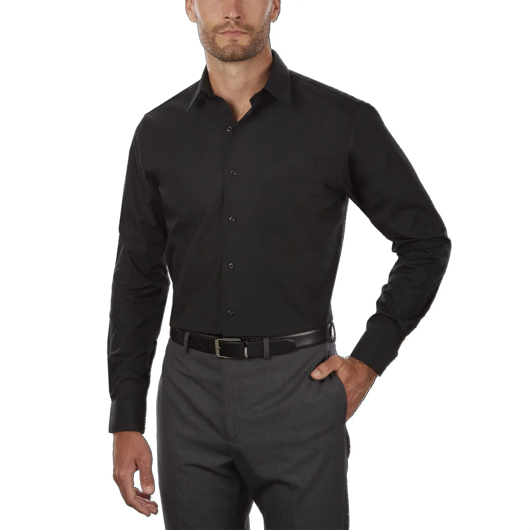 Man wearing black dress shirt with button closure and chest pocket, paired with gray trousers and black belt