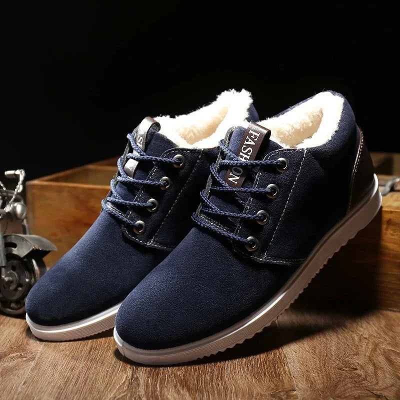 Navy blue casual sneakers with white fur lining, black heel accents, and white rubber soles on wood surface