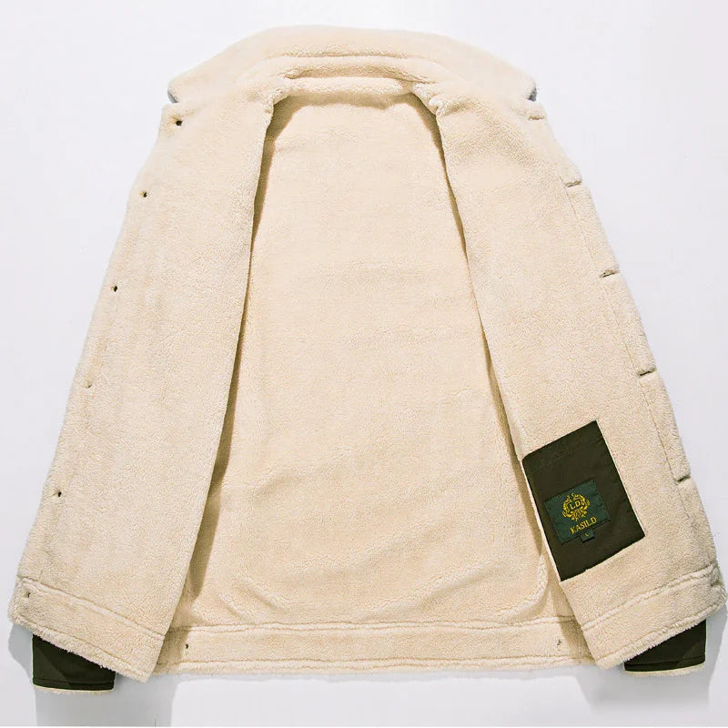 Beige sherpa fleece jacket with dark green label patch on the inside pocket, laid flat on white background